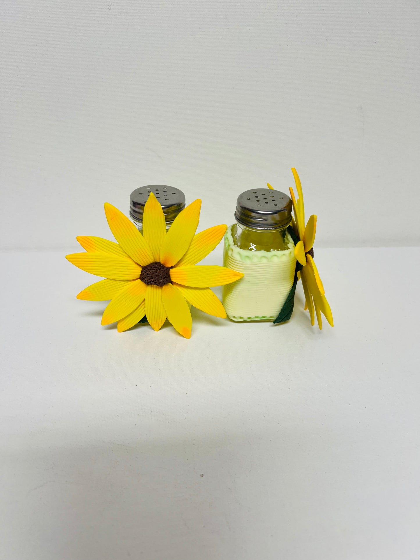 Salt and pepper set decorated with cold porcelain.