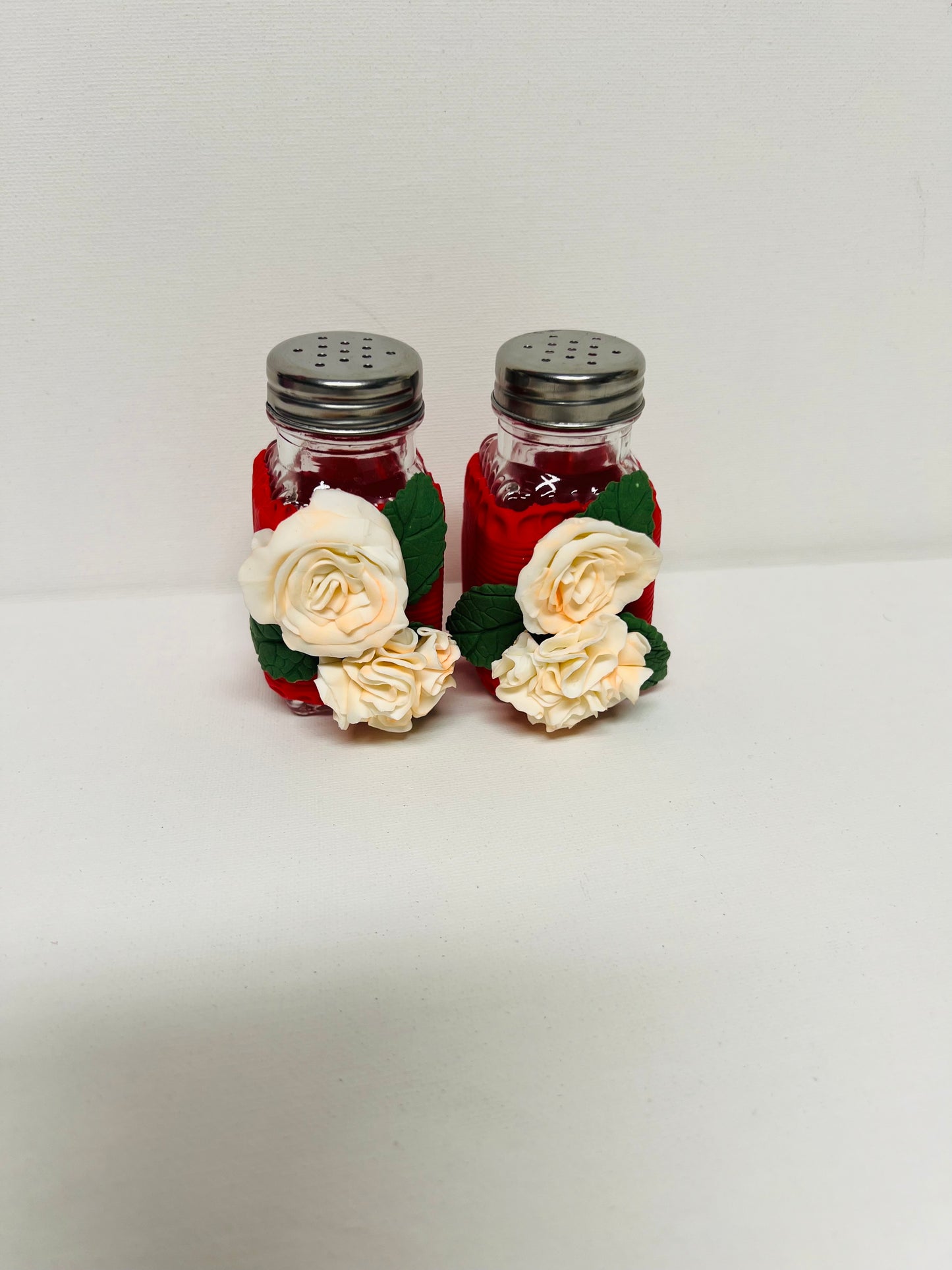 Salt and pepper set decorated with cold porcelain.