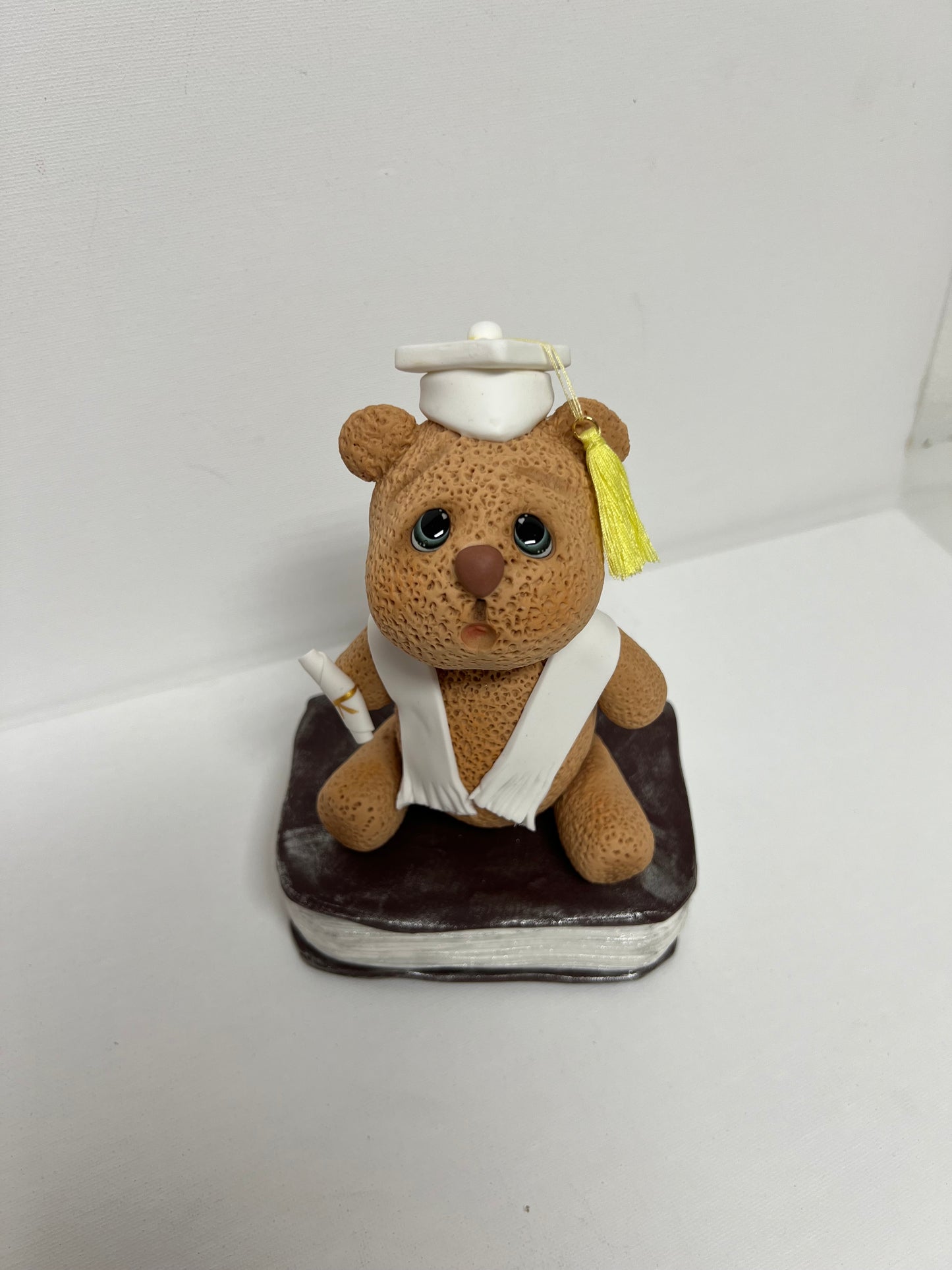 Graduation Bear in cold porcelain.